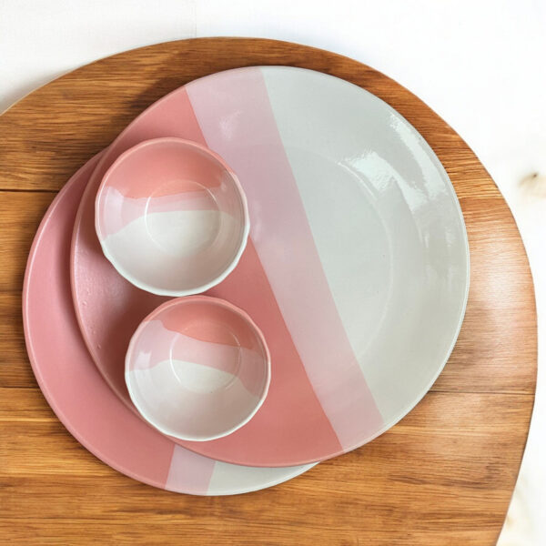 Elegant pink and white ombre ceramic plate and bowl set, perfect for stylish dining and modern table settings.